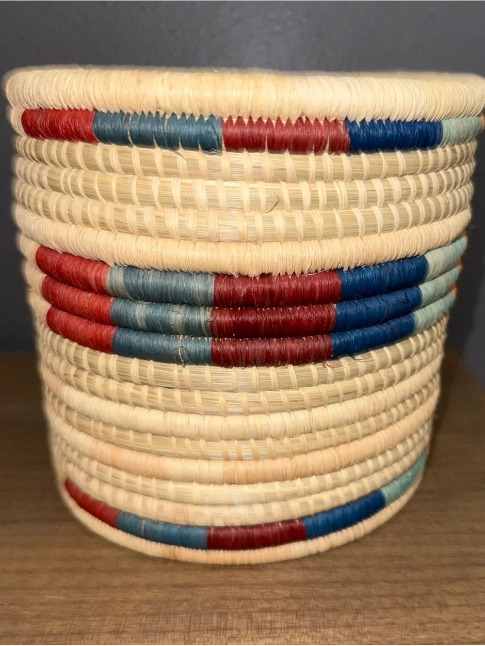 Handwoven Natural Basket with Red and Blue Accents